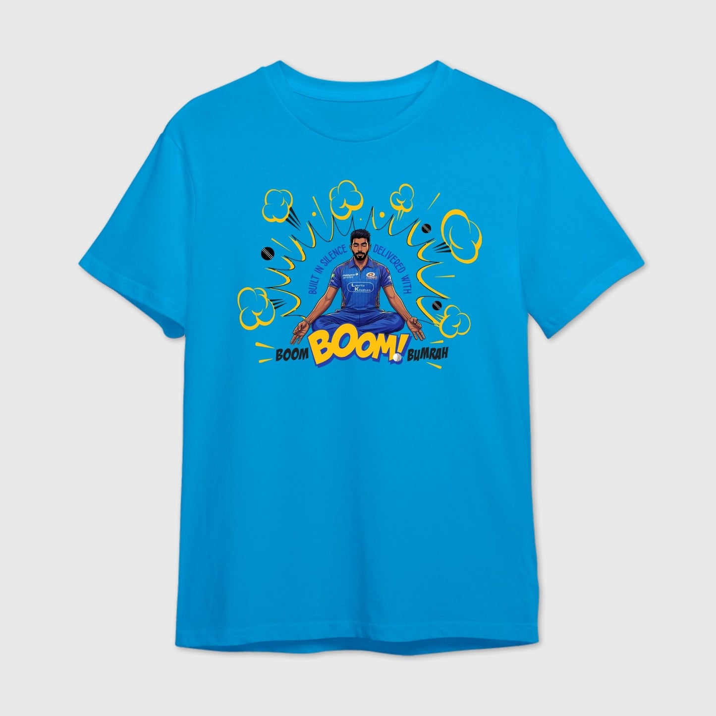 Blue t-shirt with a graphic design of Bumrah in a blue outfit and text 'Boom Boom Bumrah'