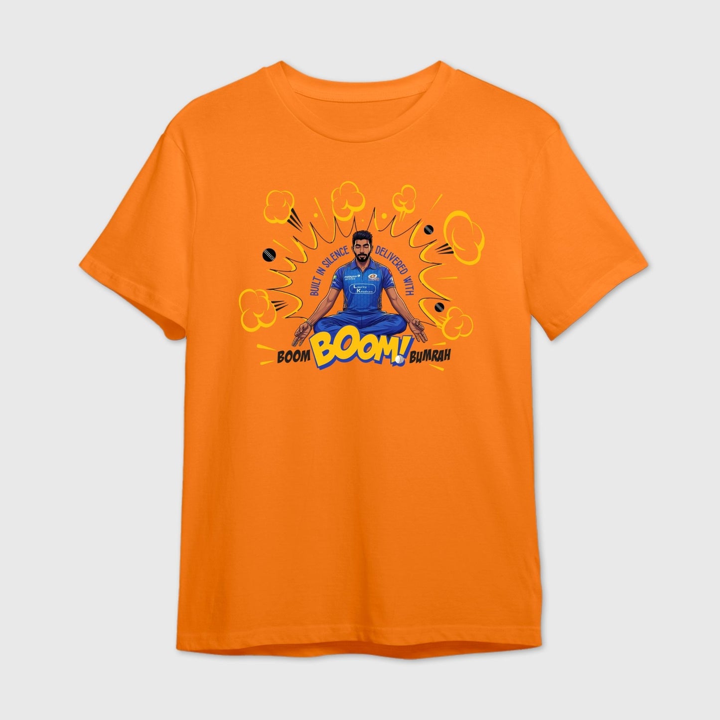 Orange t-shirt with a graphic design of Bumrah in a blue outfit and text 'Boom Boom Bumrah'