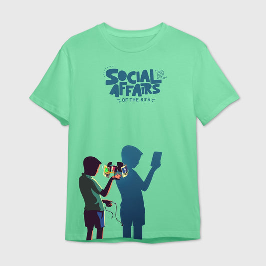 Mint green t-shirt with graphic design of two people one with spinning Top and other with mobile phones and 'Social Affairs of the 80's' text.